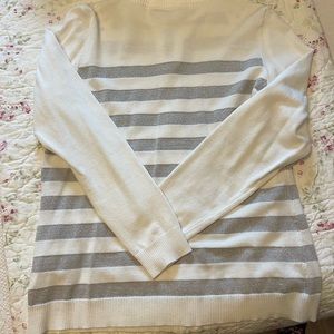 Size L white and silver zip up sweater. Rhinestone details on zipper